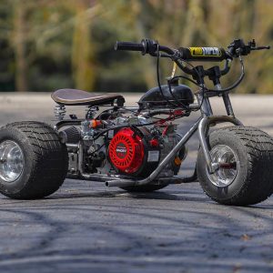 Silver Ghost Mini Trike by TGV – custom-built drift trike with chrome finish, fat rear tires, reinforced steel frame, and high-torque performance. Ideal for street riders, stunt enthusiasts, and mini bike collectors. Sleek, aggressive, and engineered for thrill.